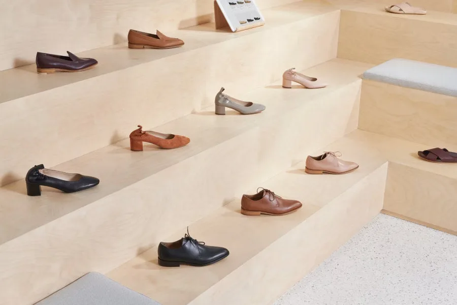 Display of various leather shoes on wooden steps