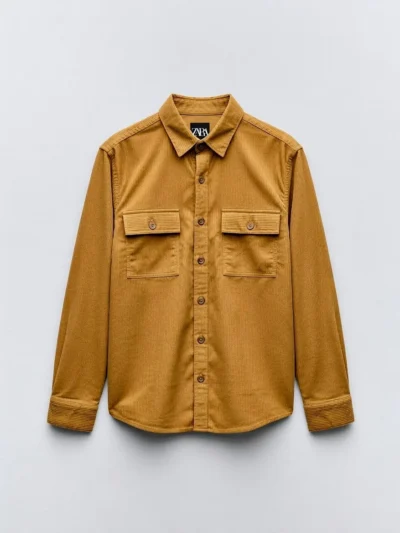 Brown corduroy shirt with two breast pockets and button-down front