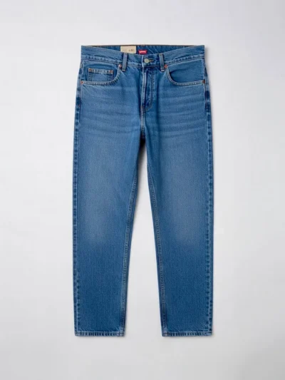 Blue denim jeans with button fly and straight leg cut