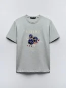 Light gray t-shirt with a graphic of three dice and 'WARRIOR CHA!' text